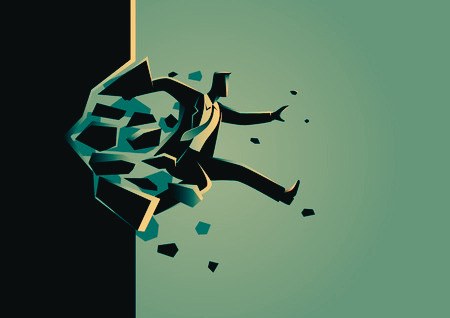 Illustration of a businessman bursting through a wall of broken bricks
