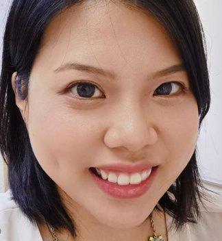 Close-up portrait of Serena Tsang smiling